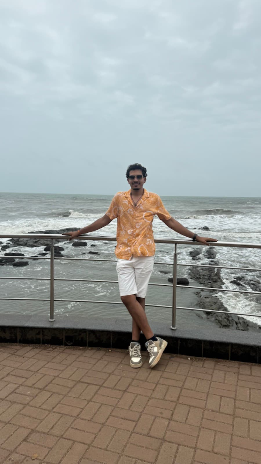 Tanishk Mittal standing by the sea
